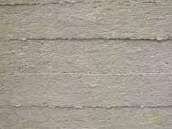 Close-up of textured concrete wall.