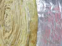 Insulation material on shiny foil surface.